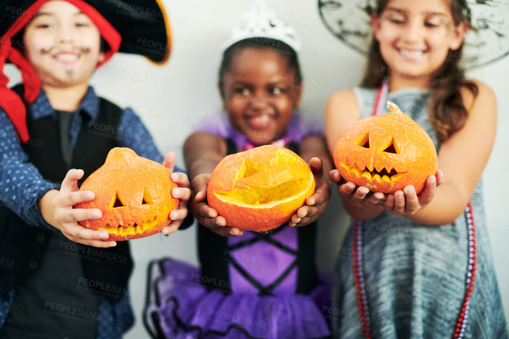 Buy stock photo Halloween, pumpkin and kids in studio with costume for fantasy, birthday party and happiness. Orange vegetable, jack o lantern and young children with creative fashion and smile by white background