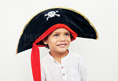 Buy stock photo Shot of a little boy wearing a pirate hat against a white background