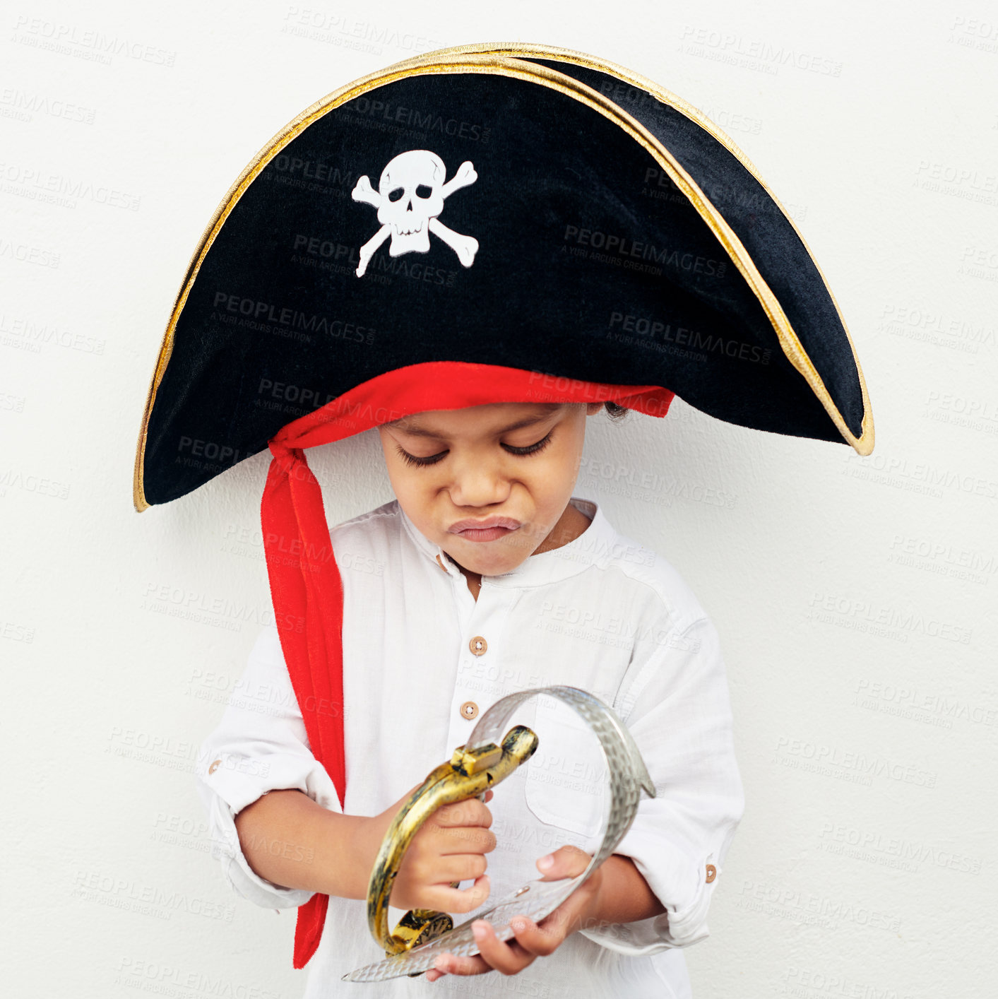 Buy stock photo Playful, child and pirate costume for halloween, birthday or party at event as kids to celebrate. Boy, creativity and clothes with toy sword, fantasy and holiday tradition as youth in America