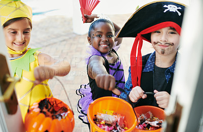 Buy stock photo Shot of a group of little children going trick-or-treating