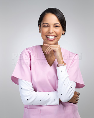 Buy stock photo Cropped portrait of an attractive young female healthcare worker standing in studio against a grey background