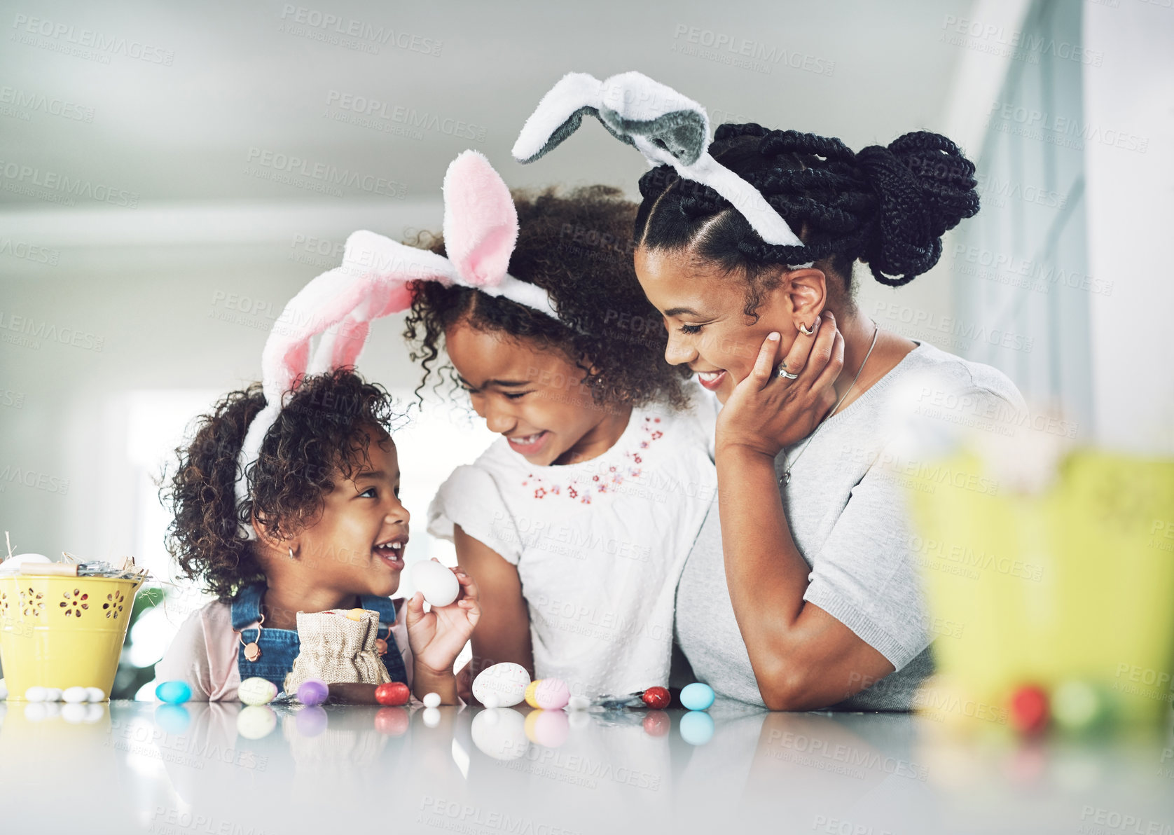 Buy stock photo Shot of a mother spending time with her daughters at home