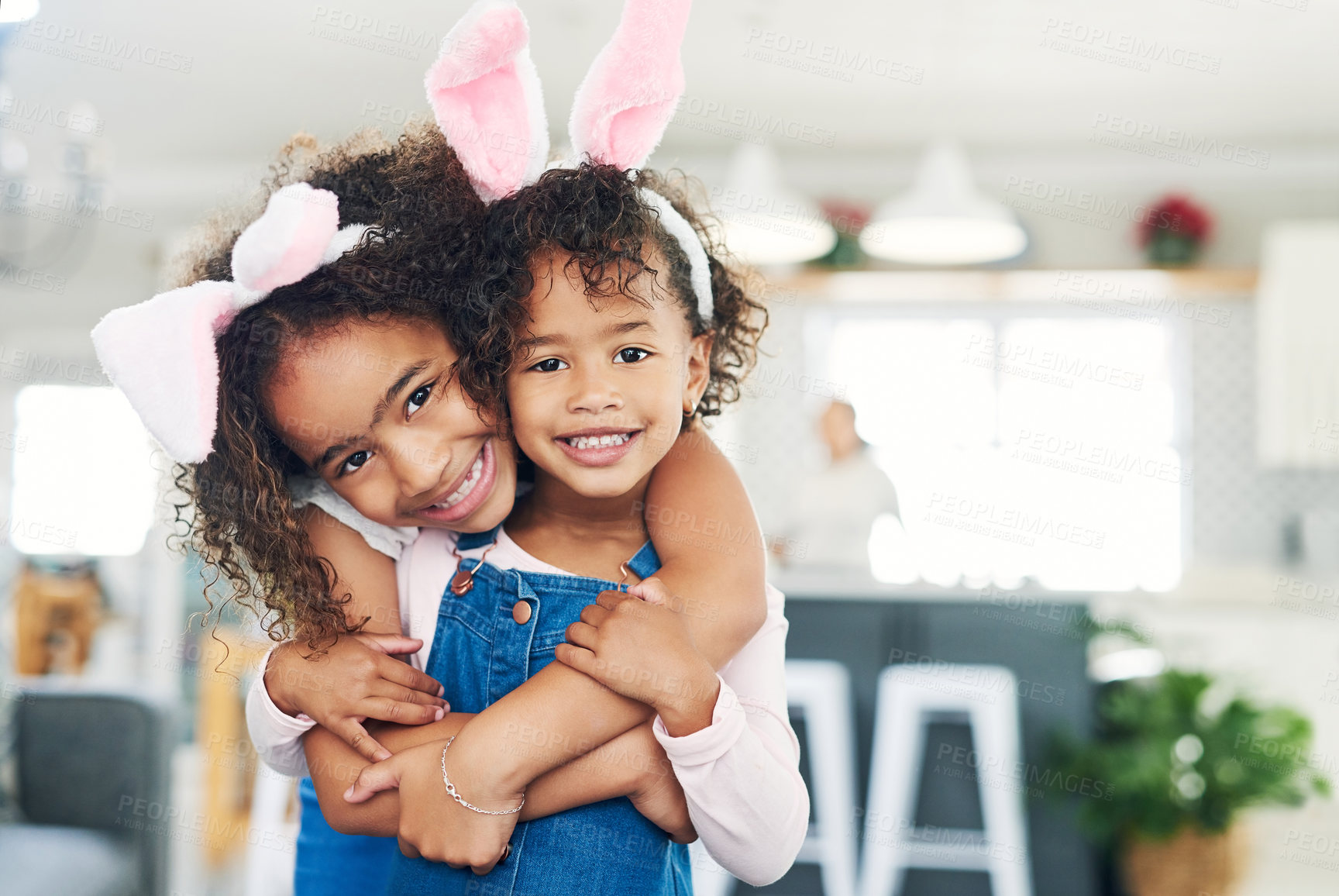 Buy stock photo Shot of two sisters playing together at home