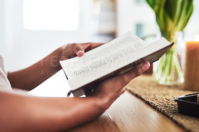 Buy stock photo Shot of an unrecognizable female reading the bible