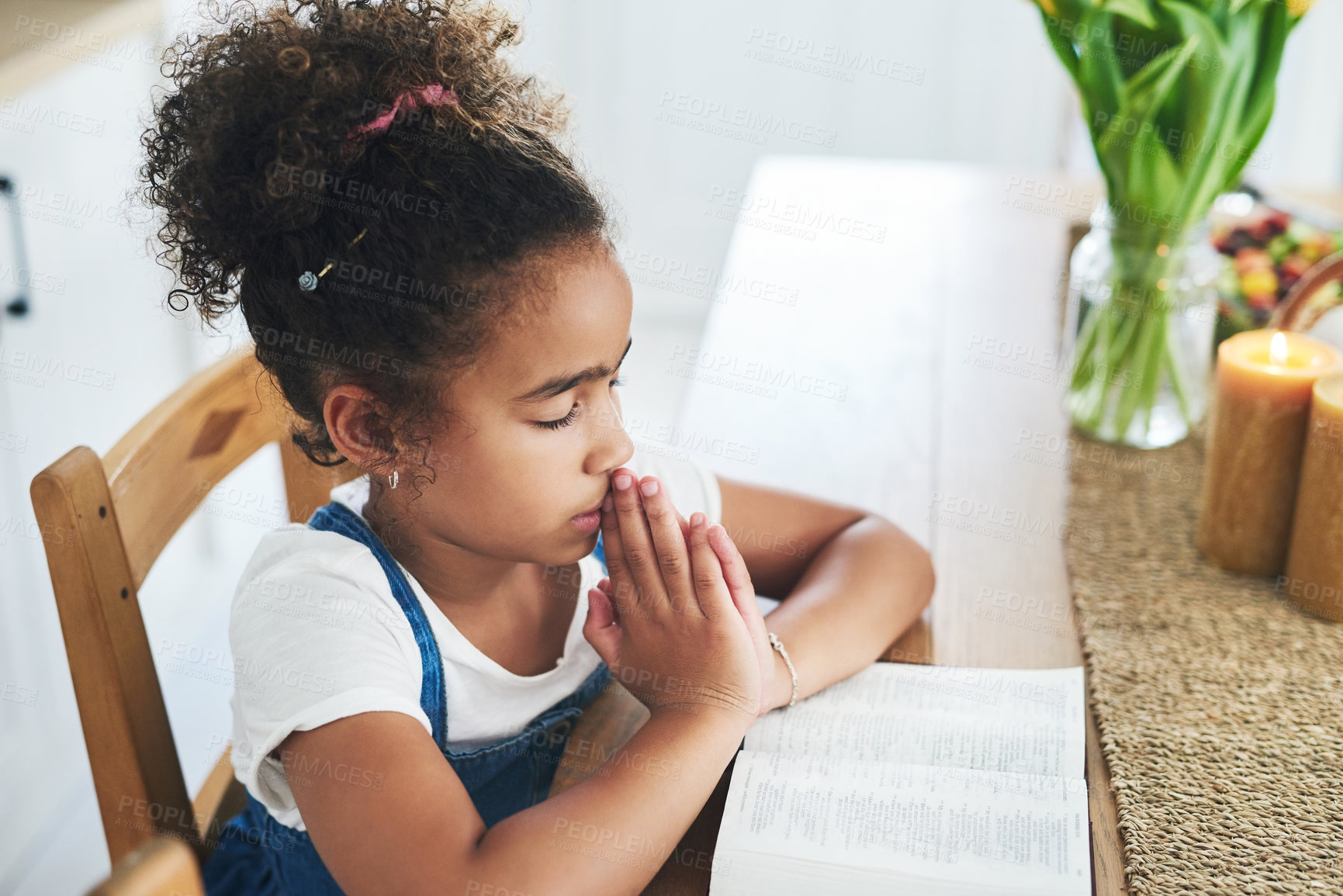 Buy stock photo Shot of a young girl praying at home