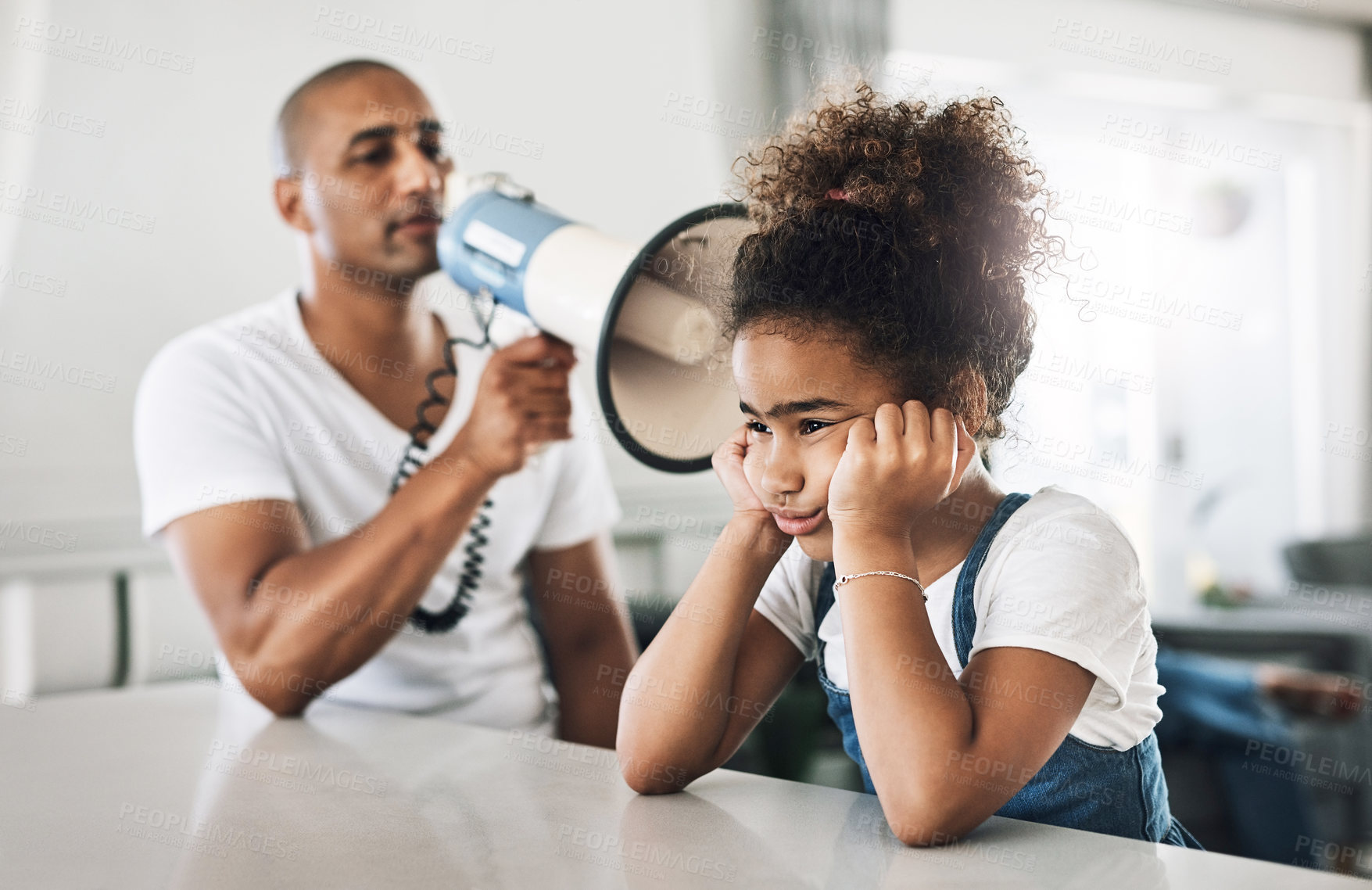 Buy stock photo Shot of a young father reprimanding a child at home