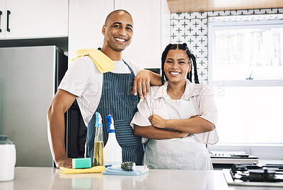 Buy stock photo Shot of a young couple cleaning at home