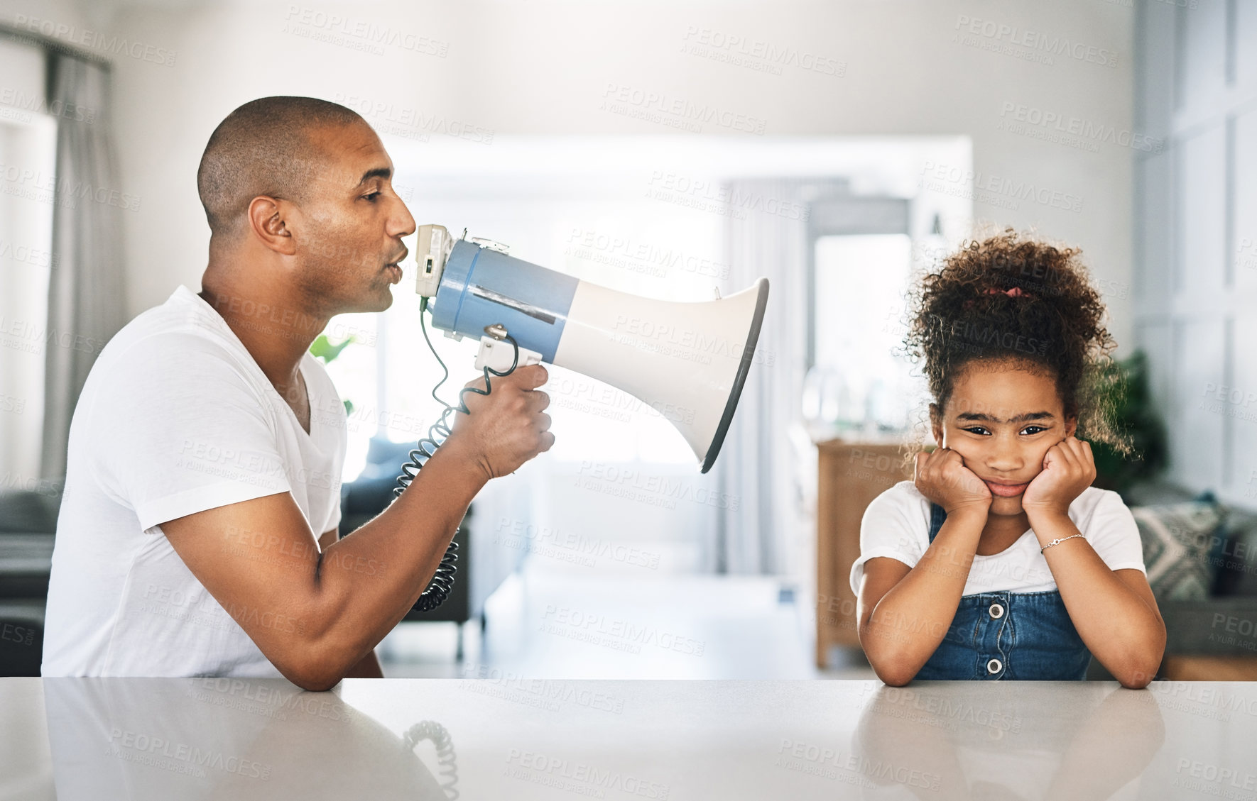 Buy stock photo Shot of a young father reprimanding a child at home