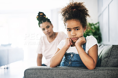 Buy stock photo Shot of a young mother reprimanding a child at home