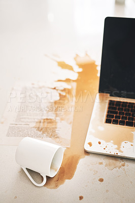 Buy stock photo Shot of a cup of coffee spilt over a laptop