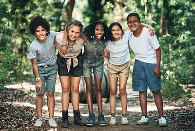 Buy stock photo Shot of a group of teenagers embracing in nature at summer camp