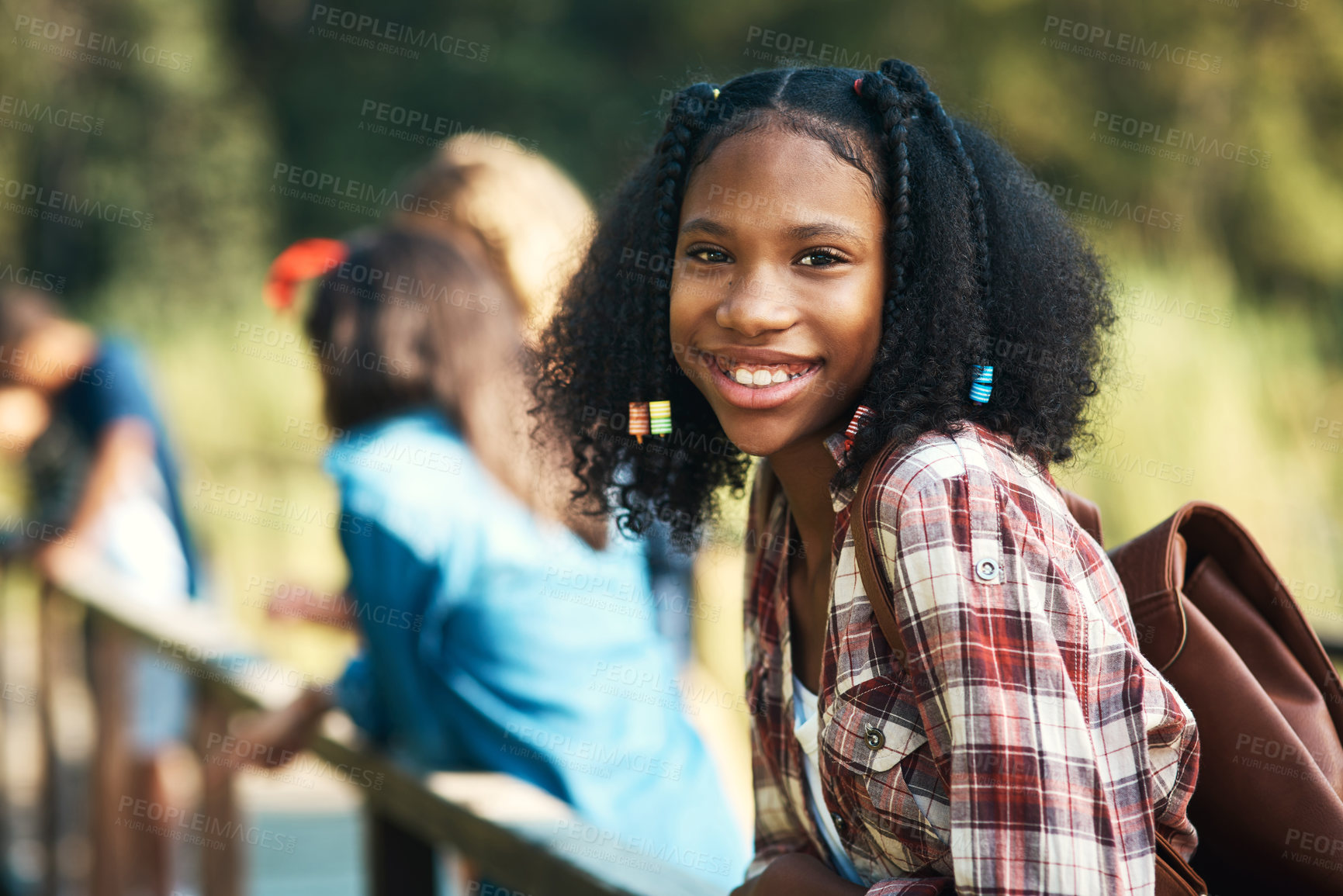 Buy stock photo Shot of a teenage girl standing on a bridge in nature at summer camp