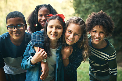 Buy stock photo Shot of a group of teenagers embracing in nature at summer camp