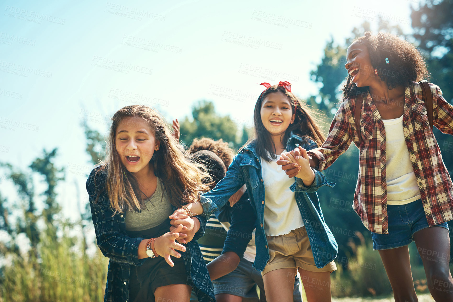 Buy stock photo Shot of a group of teenagers having fun at summer camp