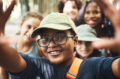 Buy stock photo Shot of a group of teenagers taking a selfie at summer camp