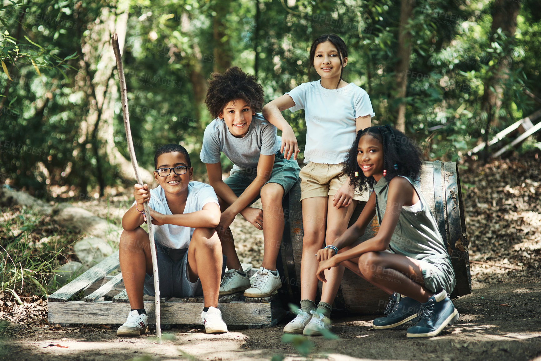 Buy stock photo Shot of a group of teenagers having fun in nature at summer camp