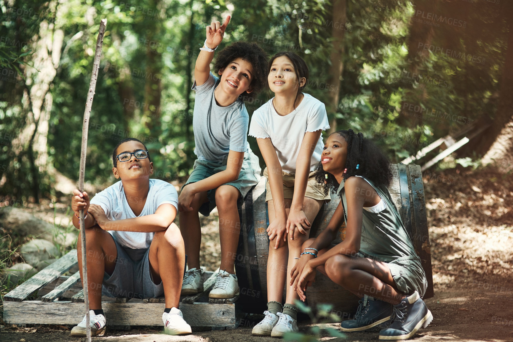 Buy stock photo Shot of a group of teenagers having fun in nature at summer camp