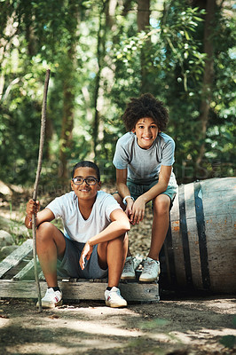 Buy stock photo Shot of two teenage boys exploring nature at summer camp