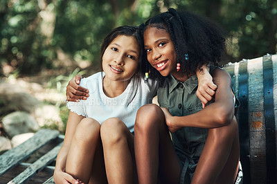 Buy stock photo Shot of two teenage girls embracing in nature at summer camp