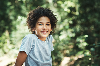 Buy stock photo Shot of a teenage boy having fun in nature at summer camp