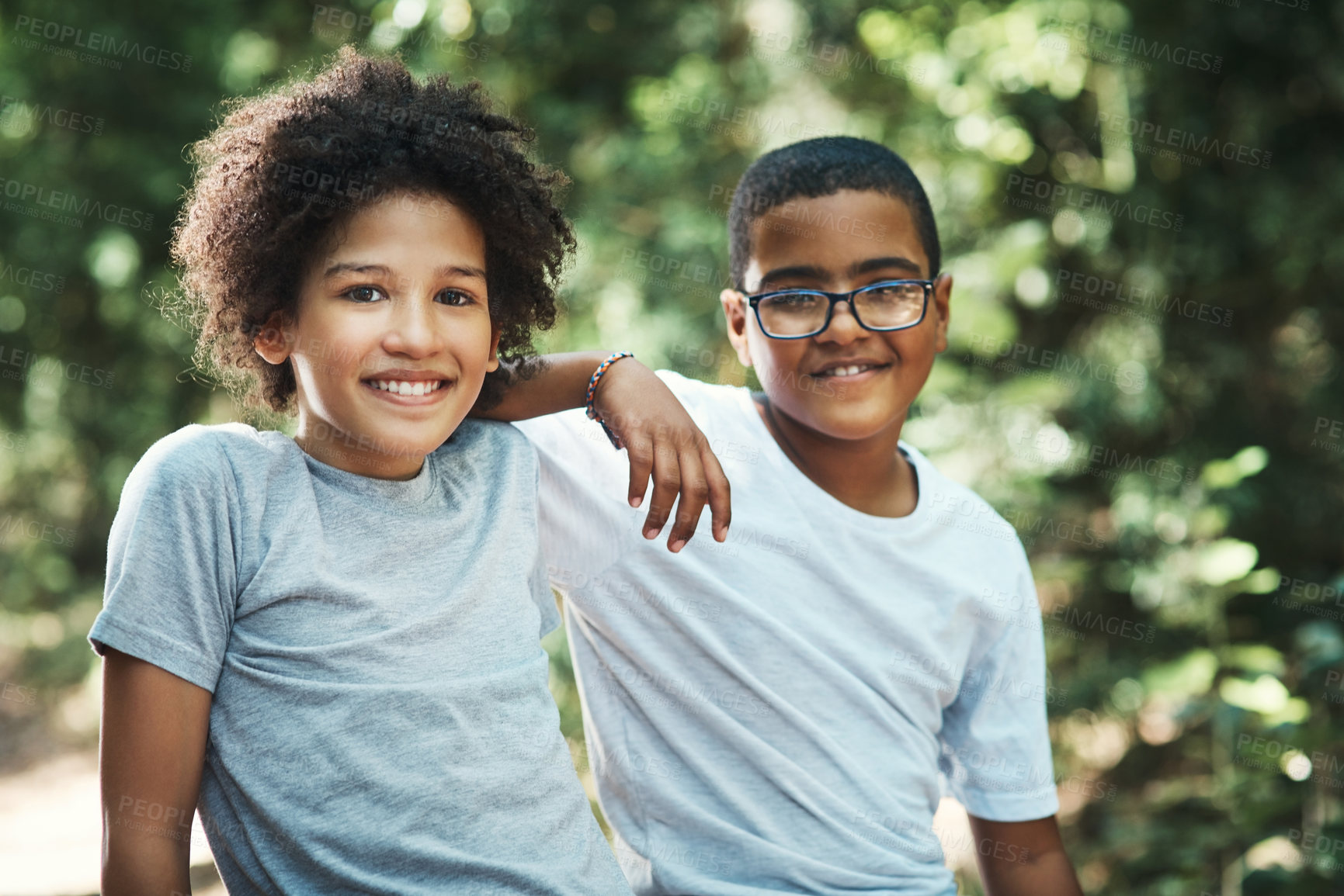 Buy stock photo Shot of two teenage boys exploring nature at summer camp