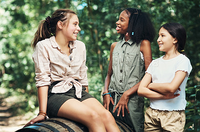 Buy stock photo Shot of a group of teenage girls having fun in nature at summer camp