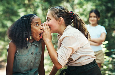 Buy stock photo Shot of two teenage girls gossiping about their friend at summer camp