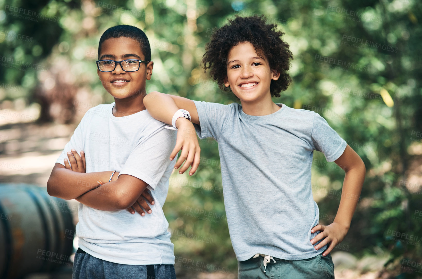 Buy stock photo Shot of two teenage boys exploring nature at summer camp