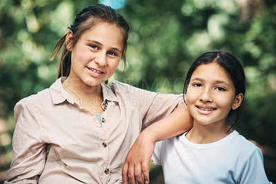 Buy stock photo Shot of two teenage girls embracing in nature at summer camp