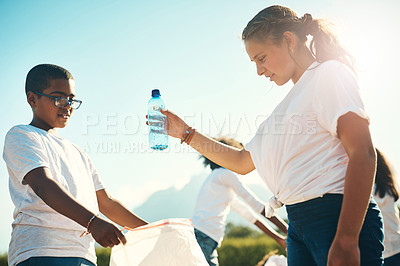 Buy stock photo Shot of a group of teenagers picking up litter summer camp