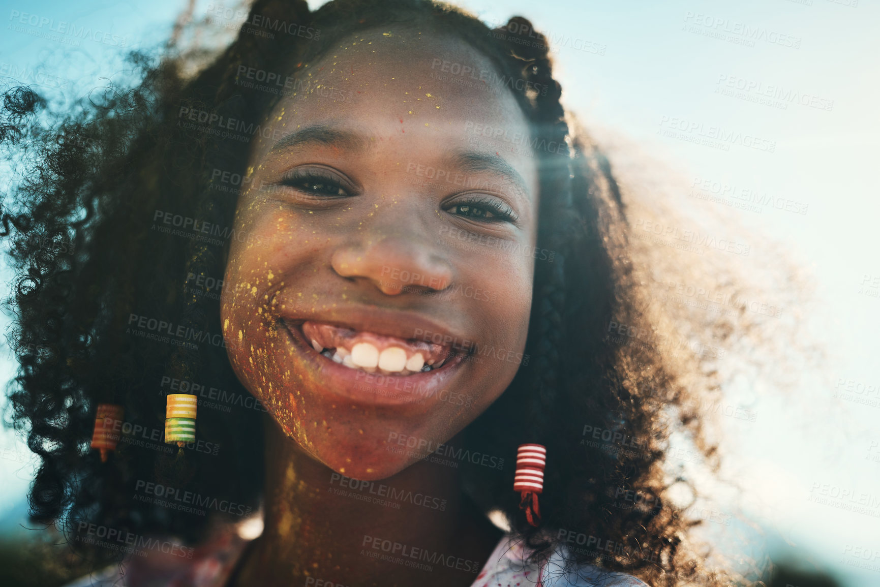 Buy stock photo Shot of a teenage girl having fun with colourful powder at summer camp