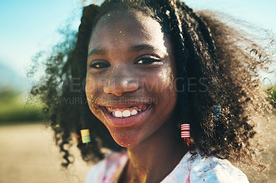 Buy stock photo Shot of a teenage girl having fun with colourful powder at summer camp