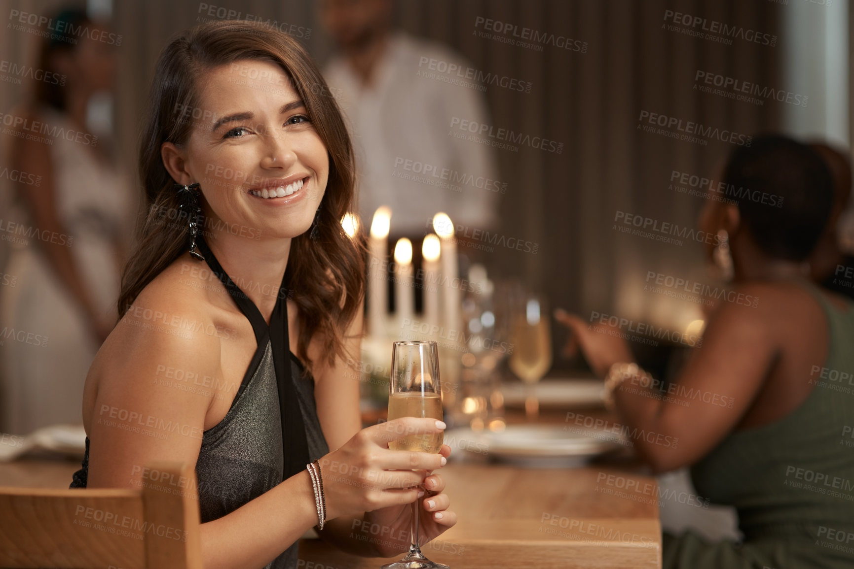 Buy stock photo Party, celebration and portrait of a woman with champagne at a new year dinner at restaurant. Happy, smile and lady sitting at dining table with glass of wine to celebrate at festive event at a house