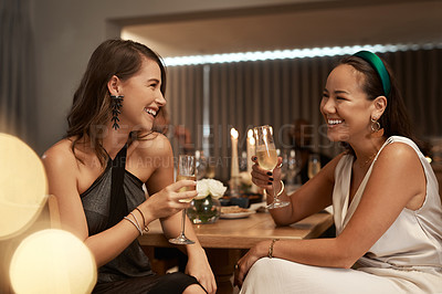 Buy stock photo Friends, champagne and women in restaurant, party and dinner for bonding. New Years, females and girls enjoy drink, smile and conversation for celebration, bond and happy at social event to relax.