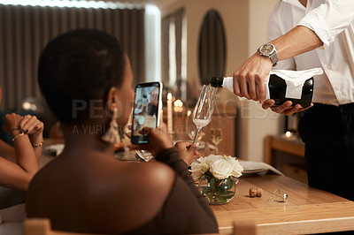 Buy stock photo Phone, black woman or hands pouring champagne at a New Years dinner party, Christmas or social event. Content creation, content creator or influencer live streaming drinks or alcohol in wine glass