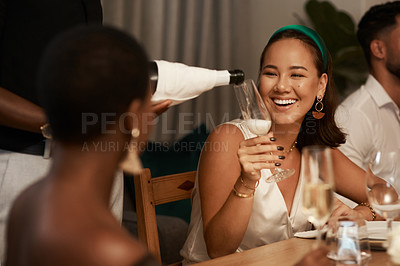 Buy stock photo Celebration, champagne and happy woman talking at a party or dinner at restaurant or house. Happiness, smile and Asian lady with glass of wine speaking at dining table at new year or christmas event.