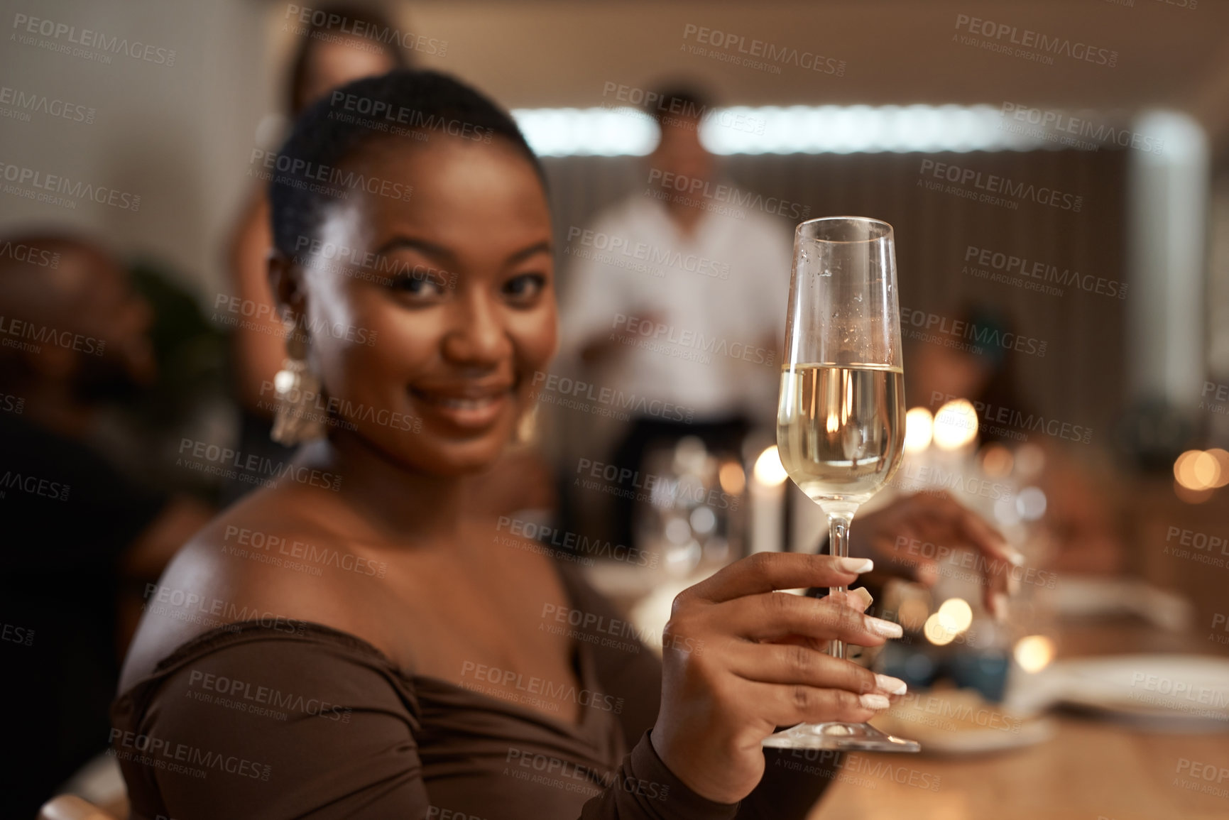 Buy stock photo Portrait, drink and woman at a dinner party celebrating with friends over a delicious meal. Alcohol, champagne and face of a black woman toast at a friendship dinner with a glass to celebrate 