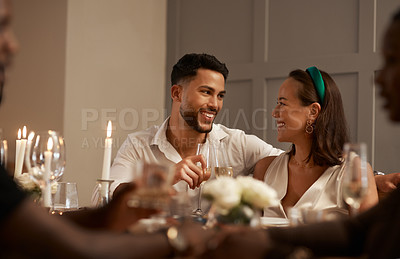 Buy stock photo Party, happy or couple friends at a dinner event in celebration of New Year or Christmas at a social gathering. Trust, smile or romantic woman drinks wine with partner to celebrate love at night