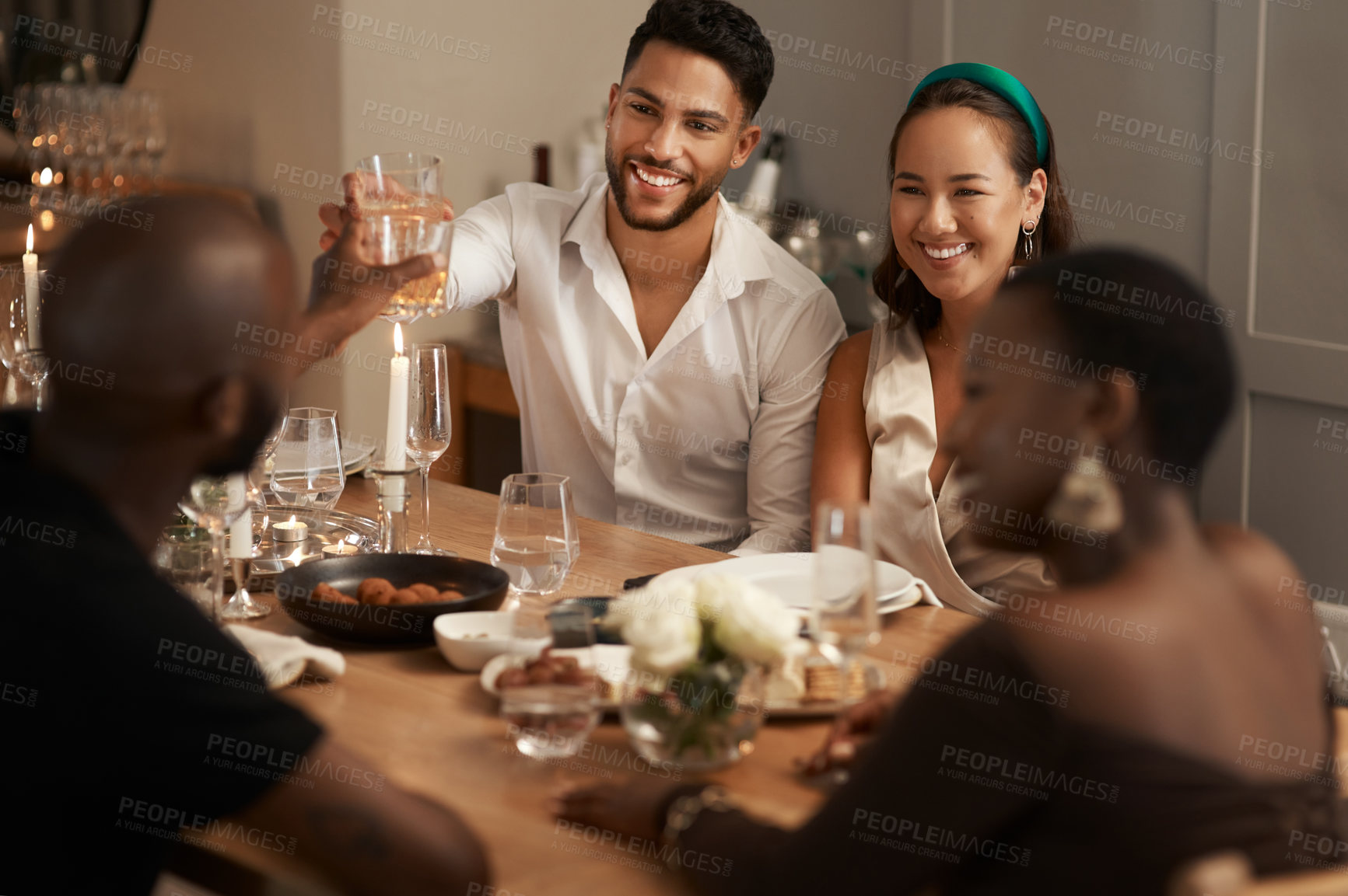Buy stock photo Wine, toast and party with friends at table of dining room for new year celebration, festive and social gathering. Drink, dinner and cheers with group of people at home for reunion, holiday and event