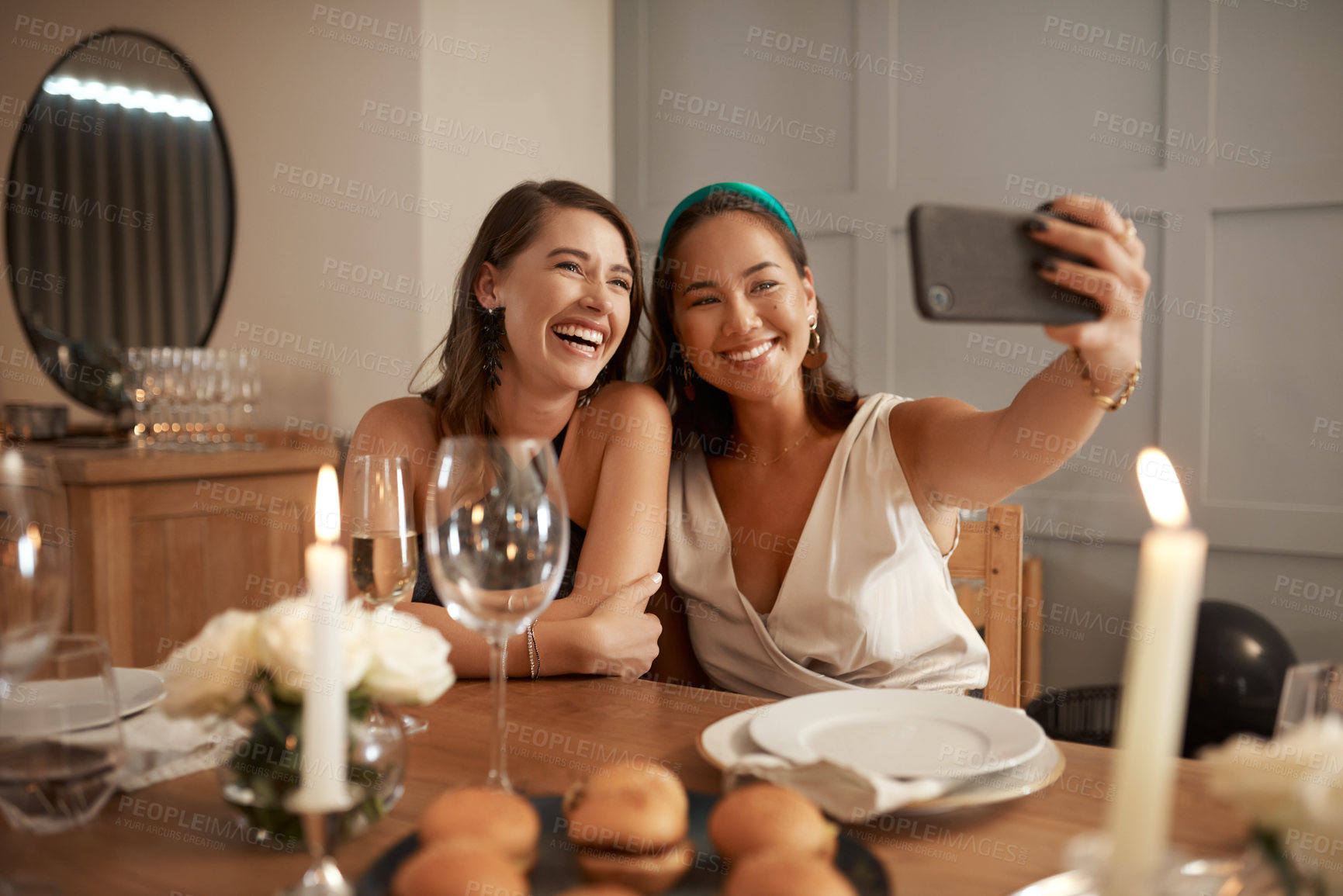 Buy stock photo Woman, friends and smile for phone selfie, dinner or friendship together at home or fine dining. Happy women smiling for photo in celebration with mobile smartphone at the dinner table indoors