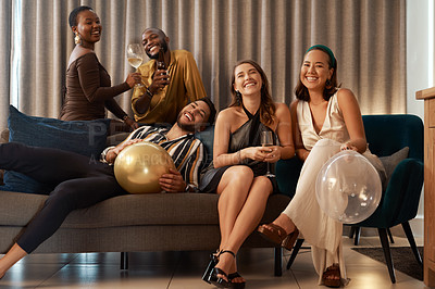 Buy stock photo Party, new year and alcohol with friends on a sofa together in celebration of a milestone event. Birthday, happy and bonding with a man and woman friend group in a living room to relax or celebrate