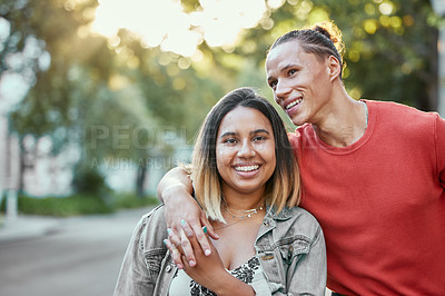 Buy stock photo Shot of a young couple walking in the city