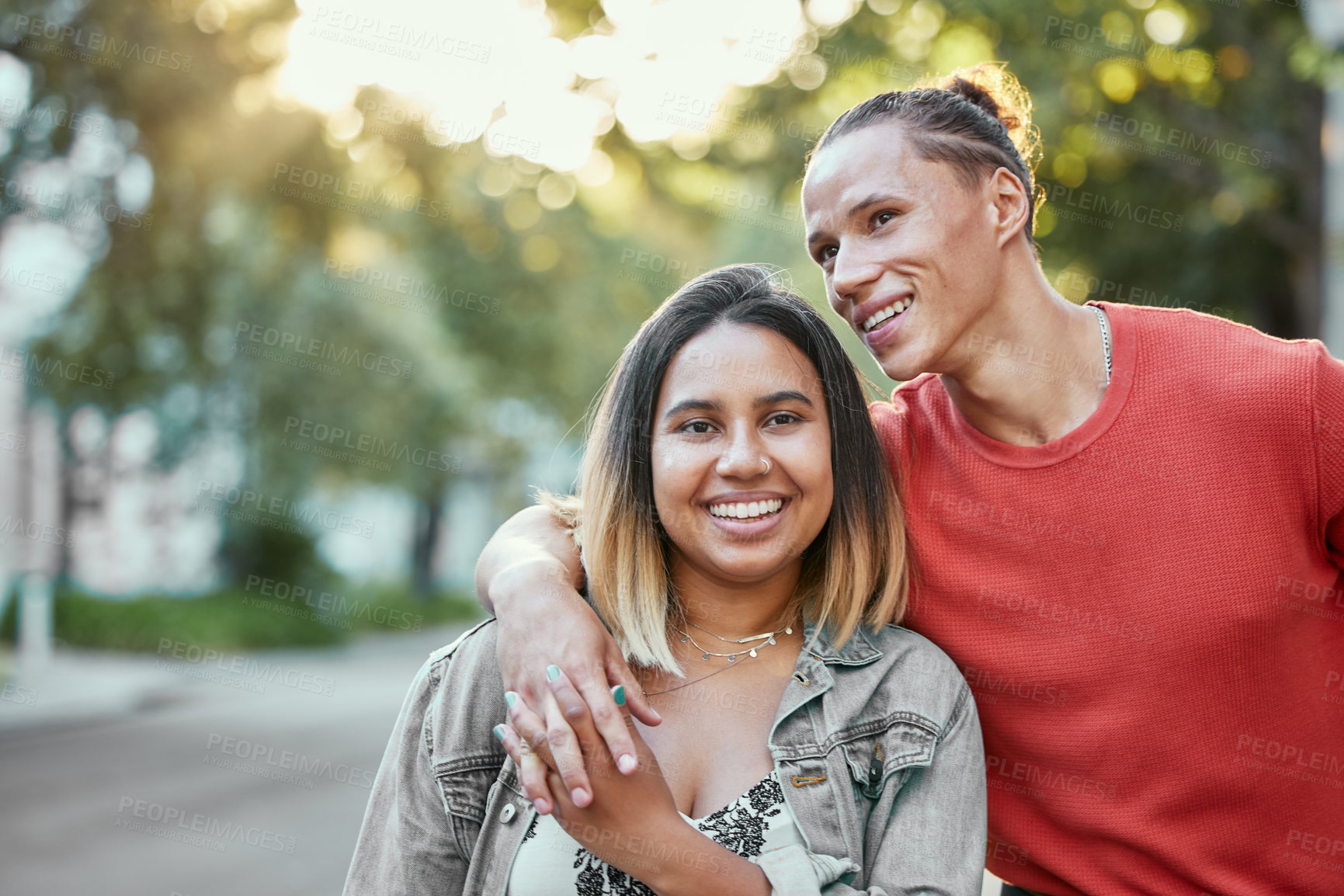 Buy stock photo Shot of a young couple walking in the city