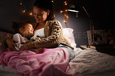 Buy stock photo Mother, kid and hug in bed at night, comfort and relax with happiness, bonding and love at family home. Calm, peace and woman and daughter together with trust, safety and security in childhood