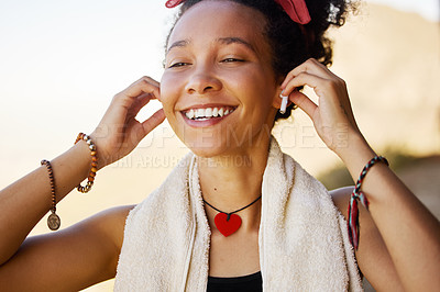 Buy stock photo Smile, earphones and black woman with music after workout, training or exercise for wellness, peace or health outdoor. Steaming, radio or gen z girl with motivation, happiness and mindset for fitness