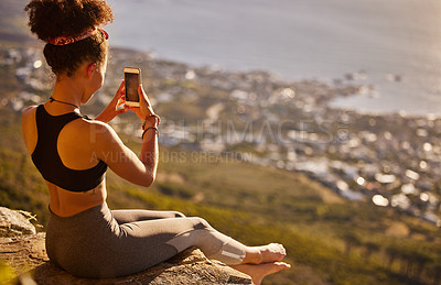 Buy stock photo Mountain, fitness and phone for picture with woman to relax from exercise, training and workout of hiking. Healthy, female person and cliff for photography of scenic view with smartphone for memory