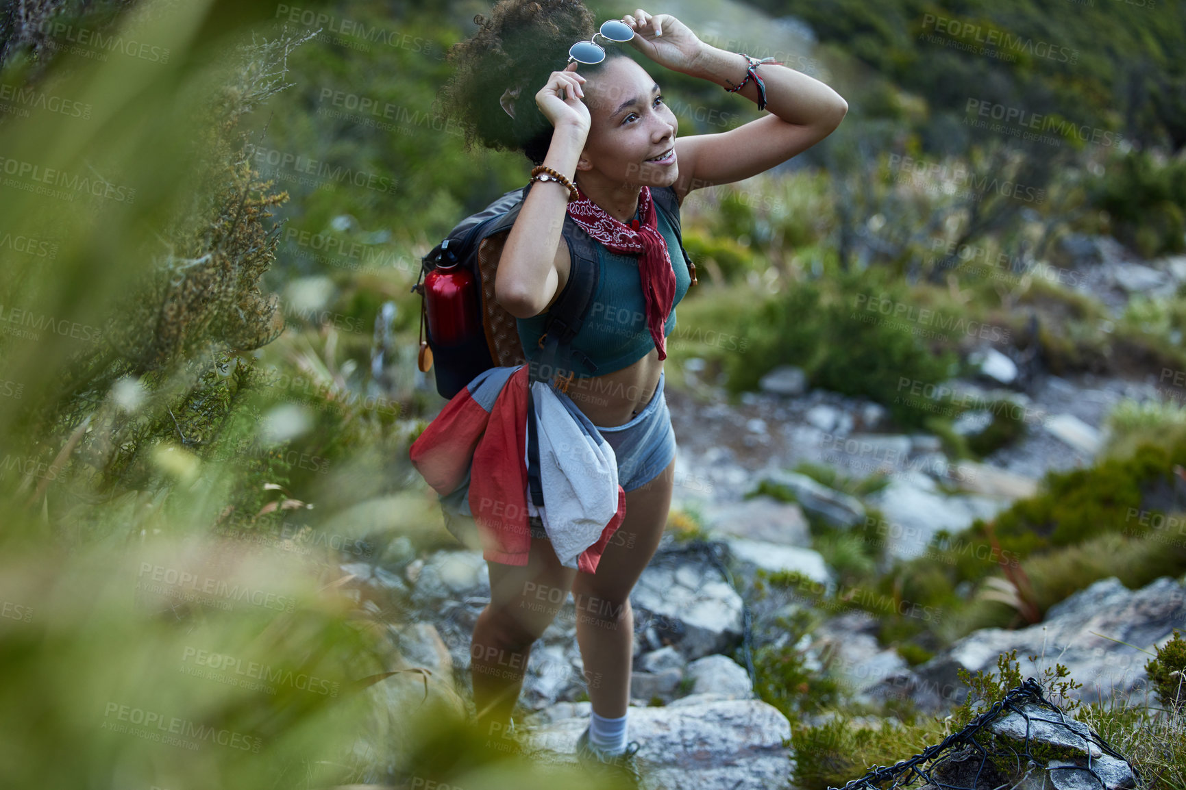 Buy stock photo Shot of a young woman out for a hike in the mountains