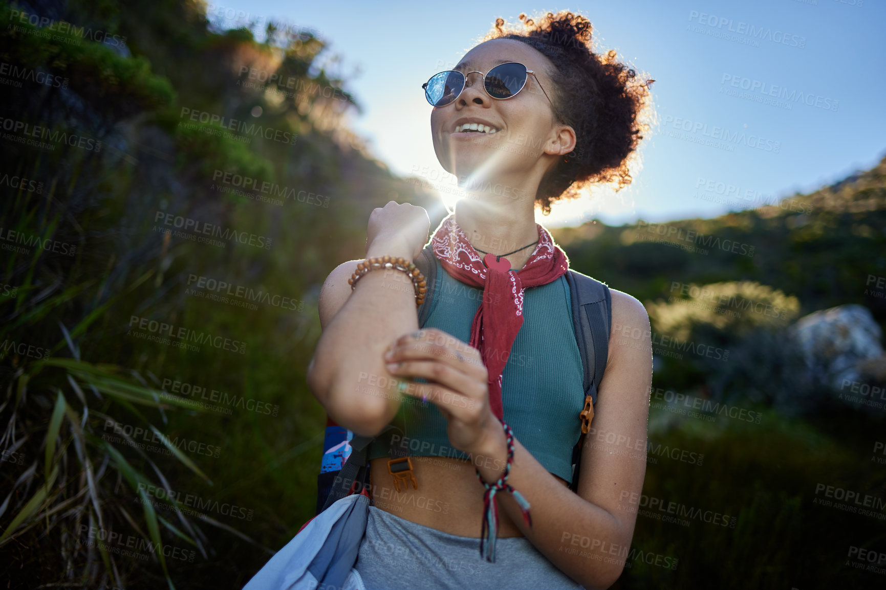 Buy stock photo Travel, sunshine and woman with sunglasses in nature for hiking in morning, adventure or explore outdoor. Smile, freedom and female person with eyewear for health, wellness lifestyle or fresh air