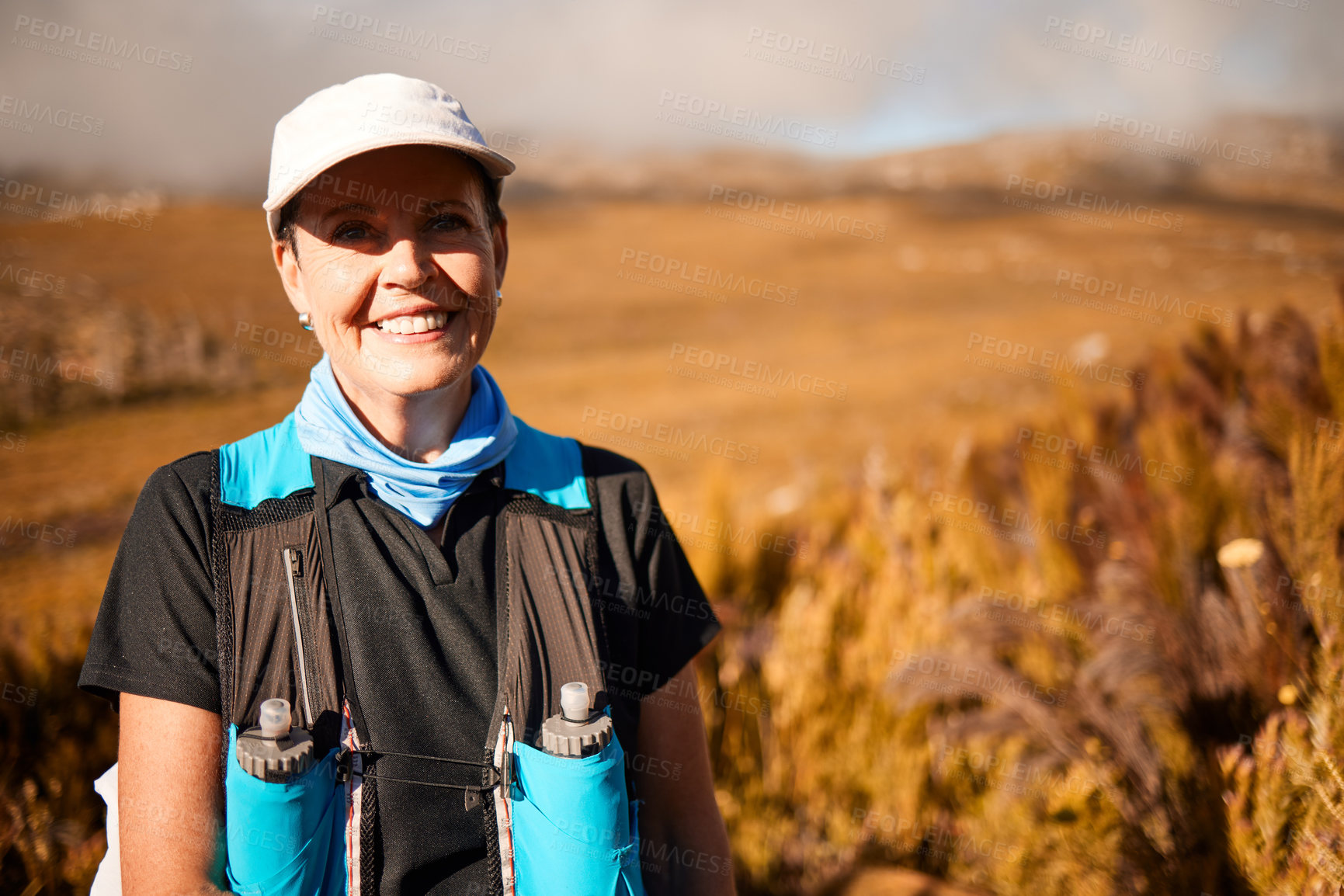 Buy stock photo Shot of a mature woman hiking in nature