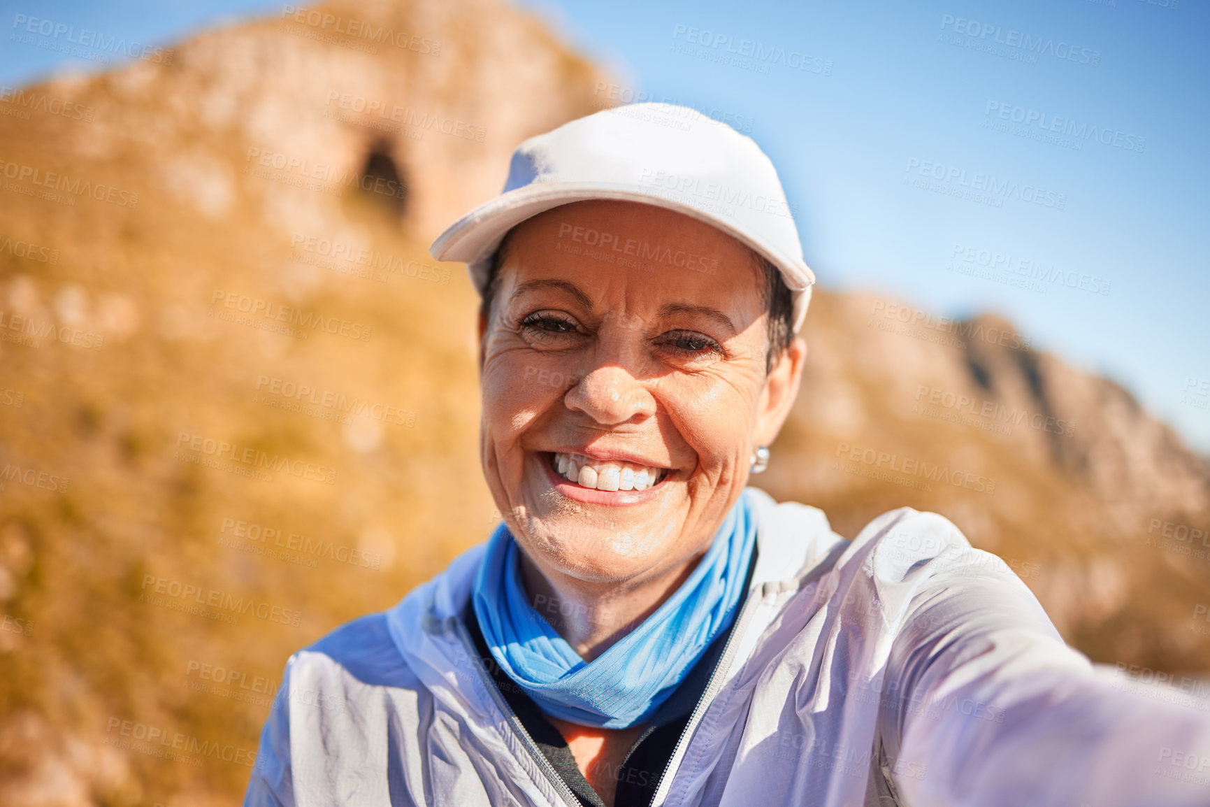 Buy stock photo Shot of a mature woman taking a selfie in nature